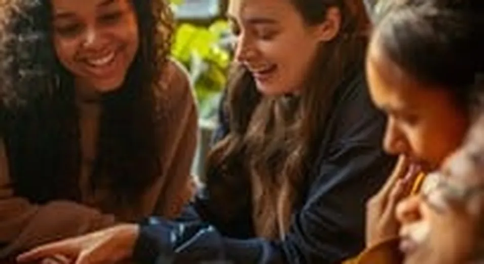 Friends enjoying board games in France
